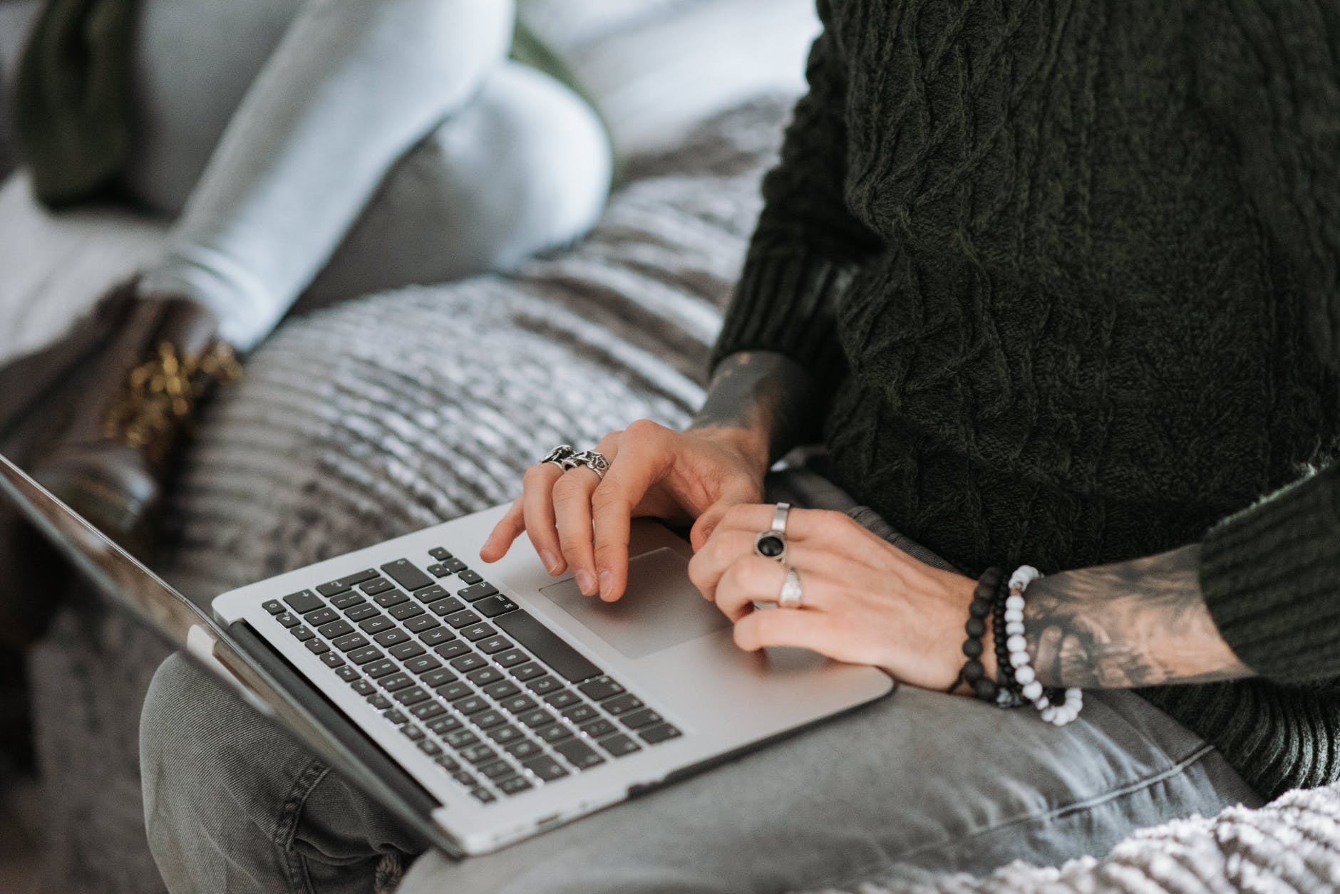 anonymous self employed man working on laptop near girlfriend at home